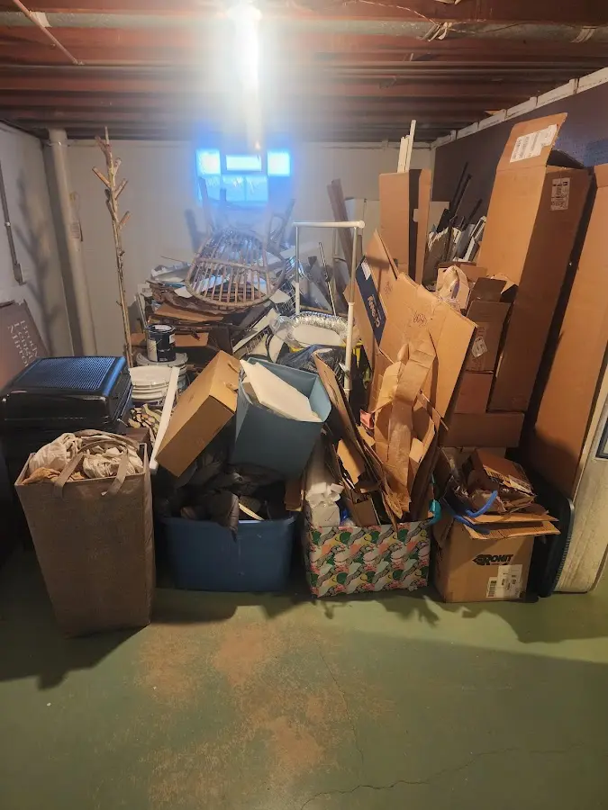 Roll-off dumpster container at job site for 2 Yard Dumpster Rental in Springhill